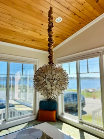 a vase of flowers sitting on a window sill