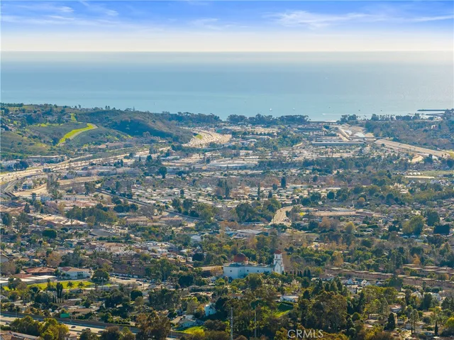 a view of a city with mountains in the background