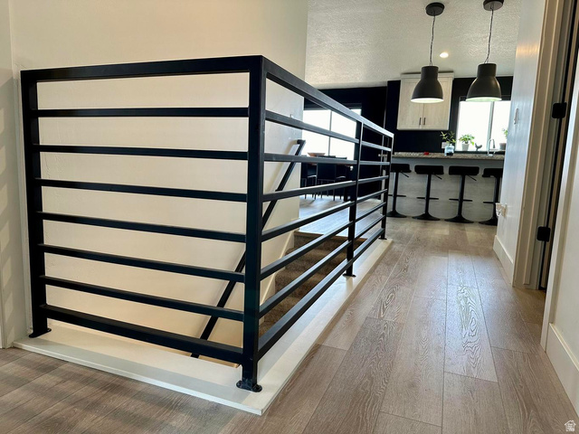 4349 Half Mile Road East Enoch, UT 84721 - Photo 26 of 36 Staircase featuring hardwood / wood-style floors