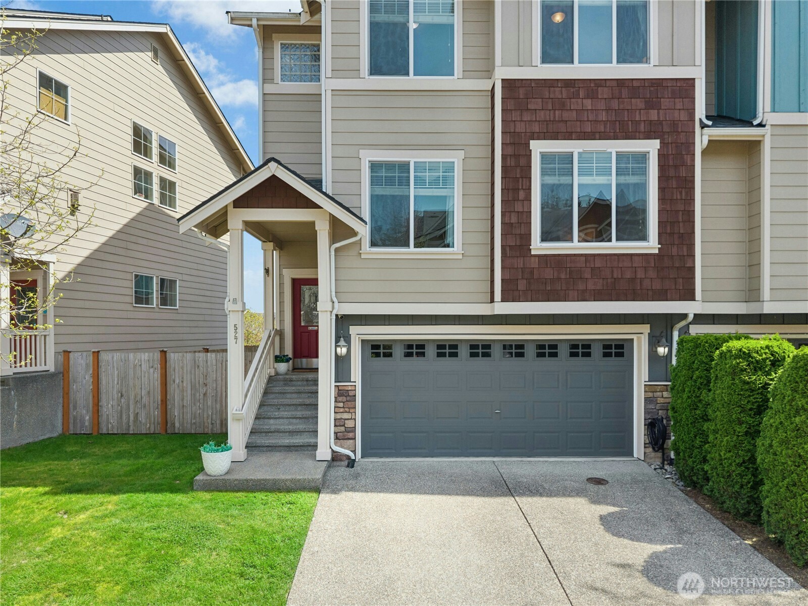 527 Pilchuck Path Everett, WA 98201 - Photo 1 of 38 a front view of a house with a yard and garage