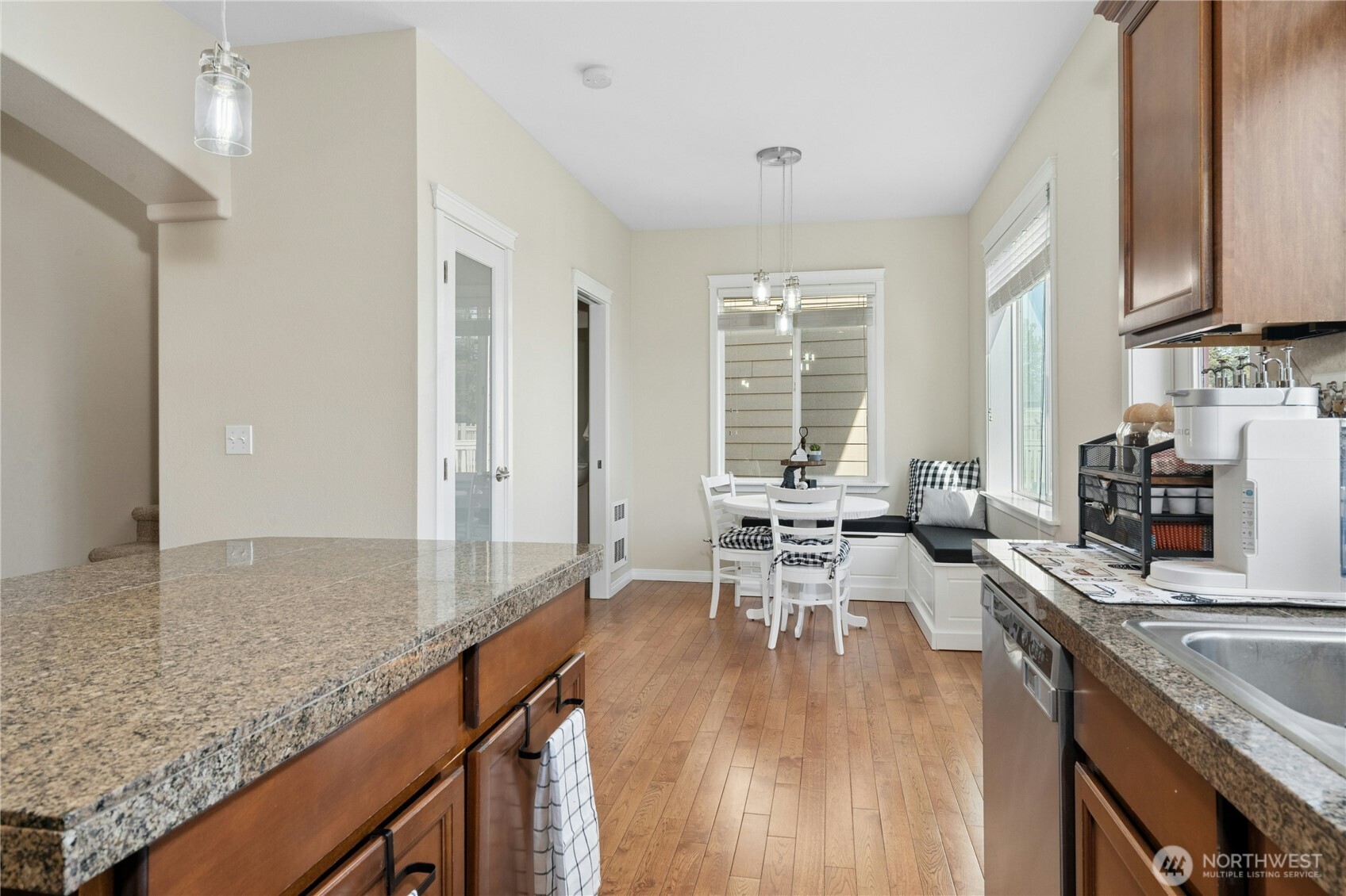 527 Pilchuck Path Everett, WA 98201 - Photo 13 of 38 a kitchen with granite countertop lots of counter top space and dining table