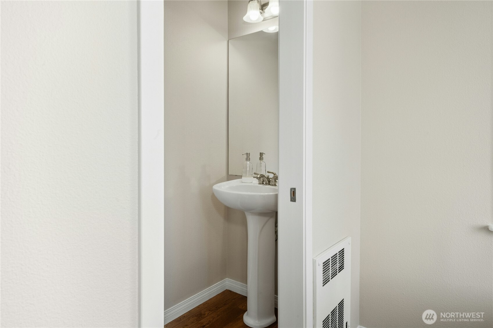 527 Pilchuck Path Everett, WA 98201 - Photo 15 of 38 a bathroom with a sink a mirror and a window