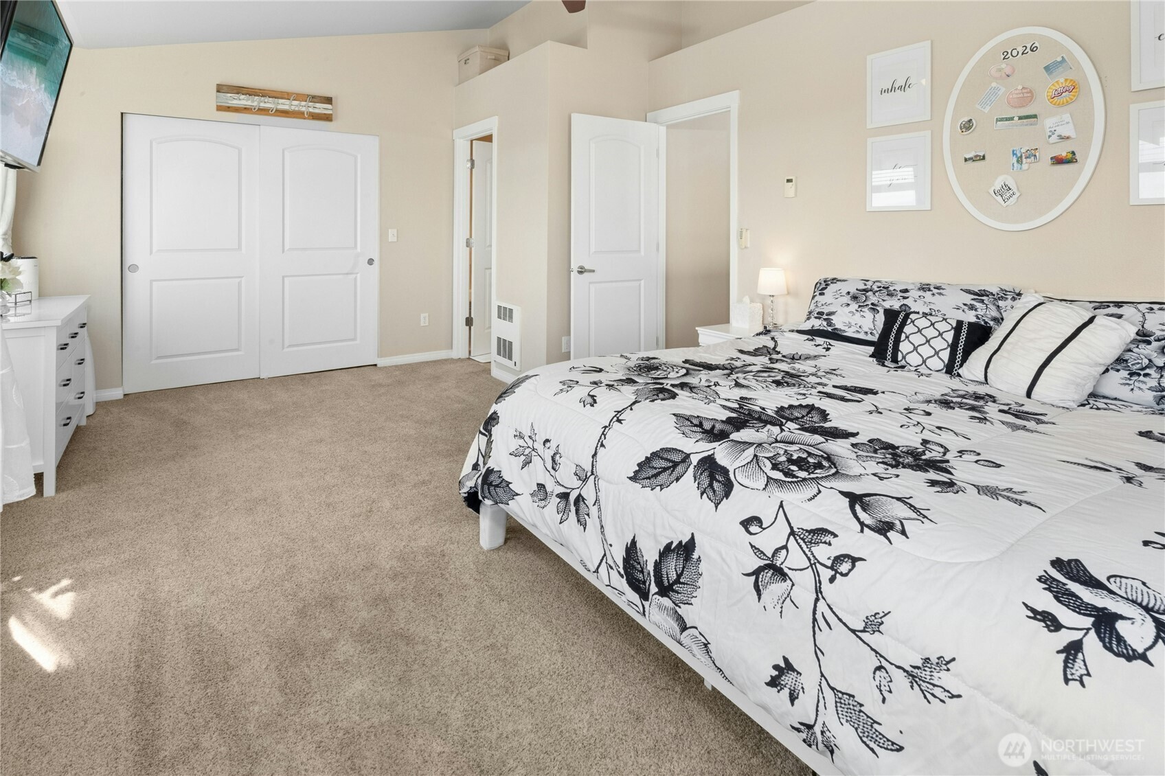527 Pilchuck Path Everett, WA 98201 - Photo 19 of 38 a bed with a white comforter and pillows