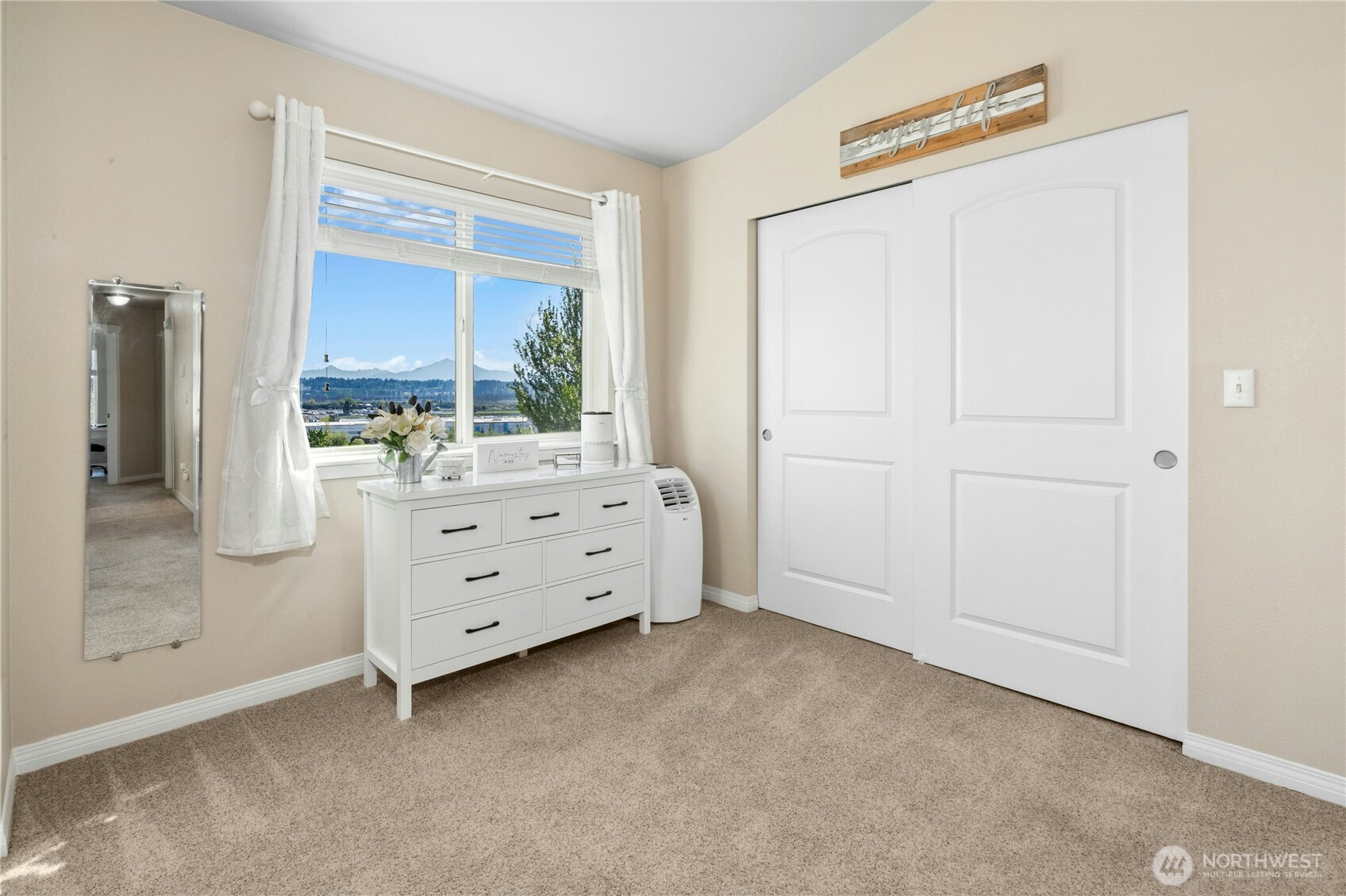 527 Pilchuck Path Everett, WA 98201 - Photo 20 of 38 a room with a dresser and a window
