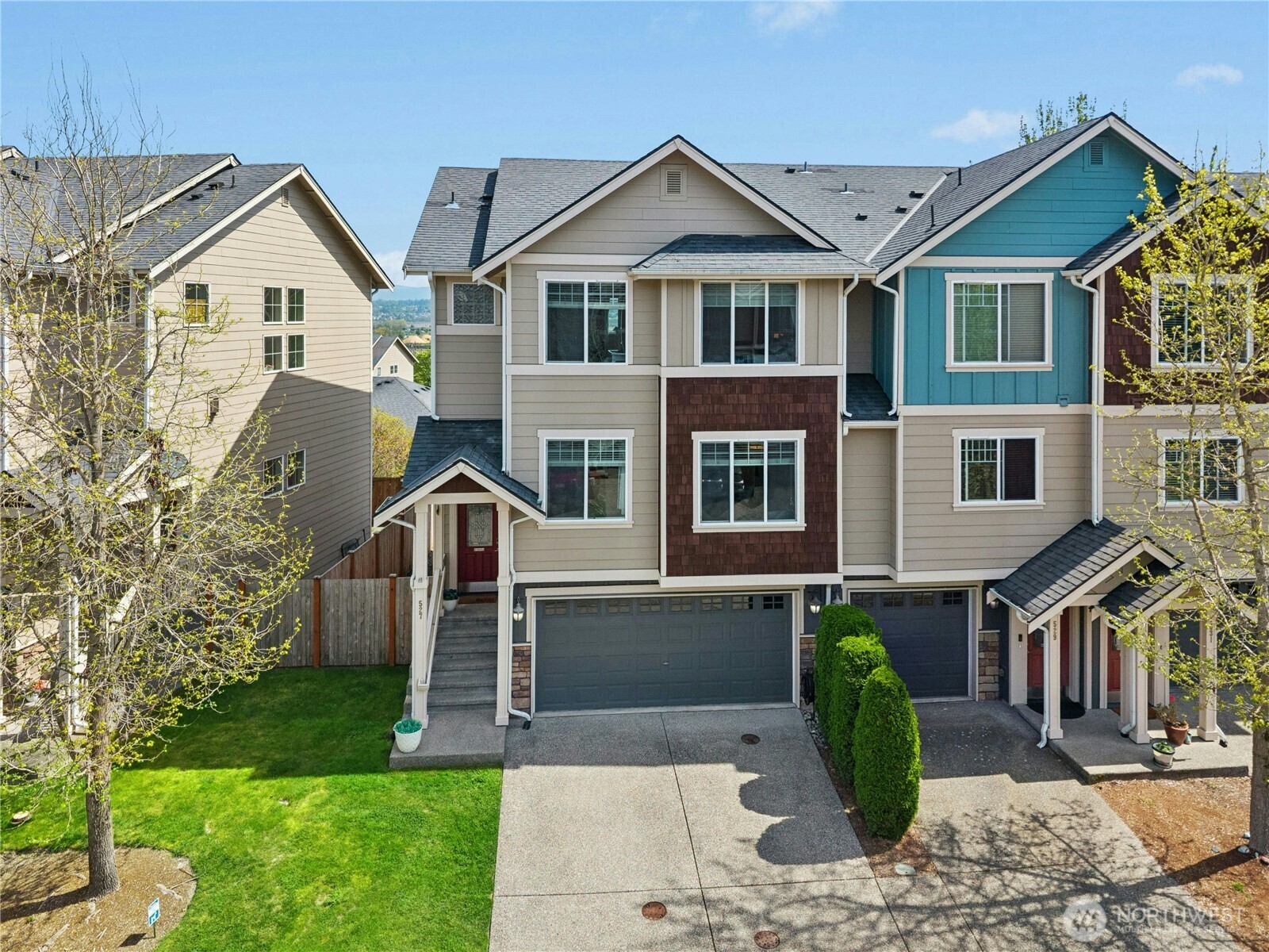 527 Pilchuck Path Everett, WA 98201 - Photo 2 of 38 a front view of a house with a yard and potted plants