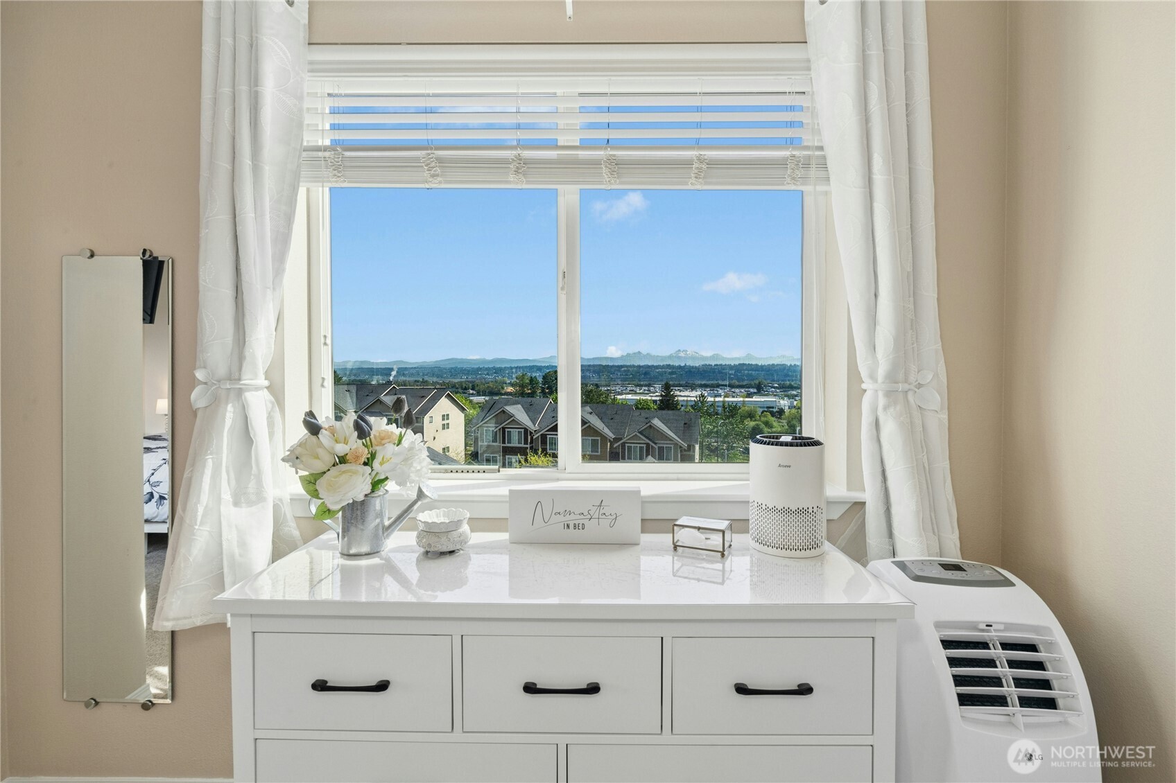 527 Pilchuck Path Everett, WA 98201 - Photo 21 of 38 a bathroom with a double vanity sink and a large mirror