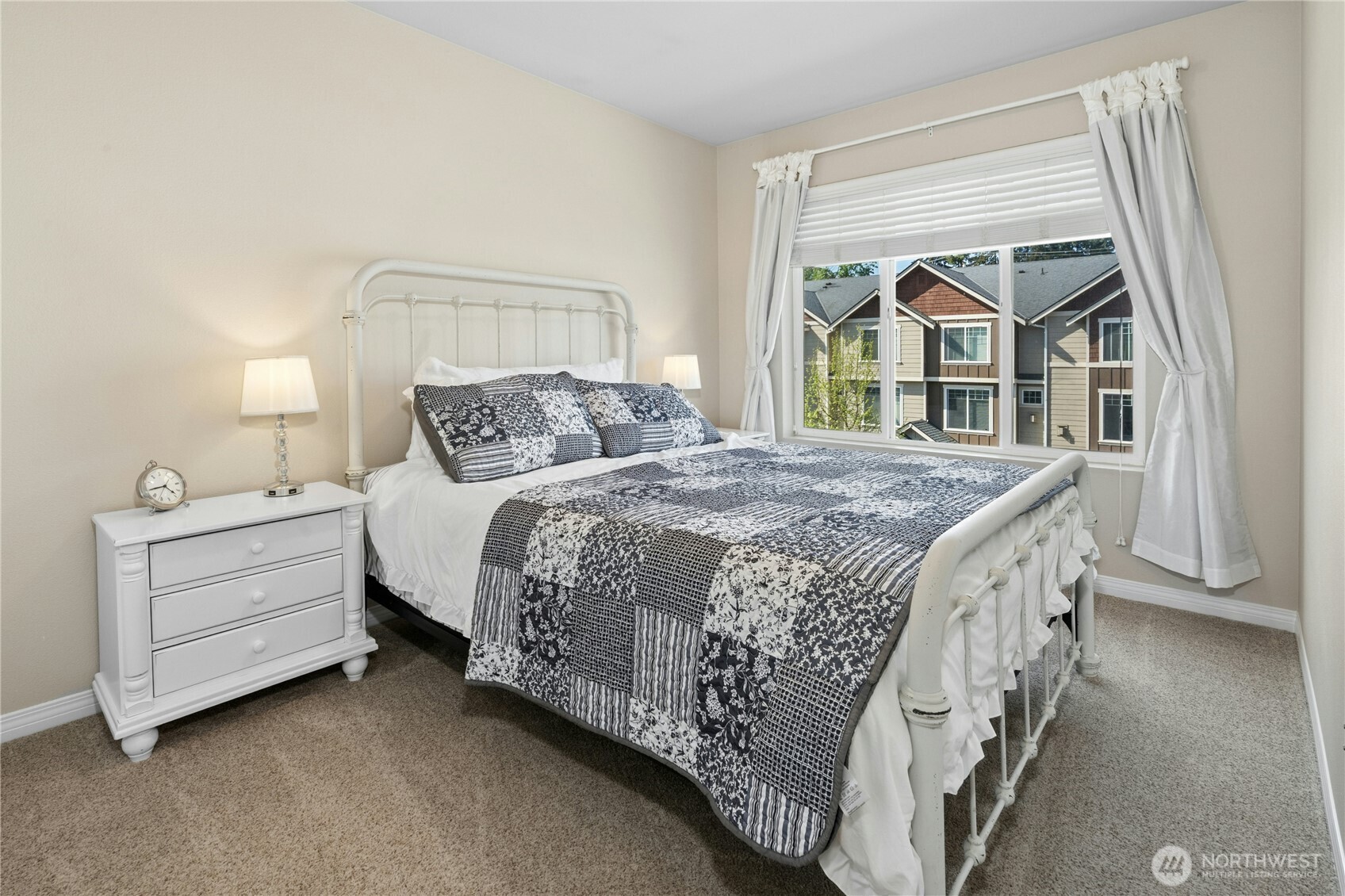 527 Pilchuck Path Everett, WA 98201 - Photo 24 of 38 a bedroom with a bed and a window