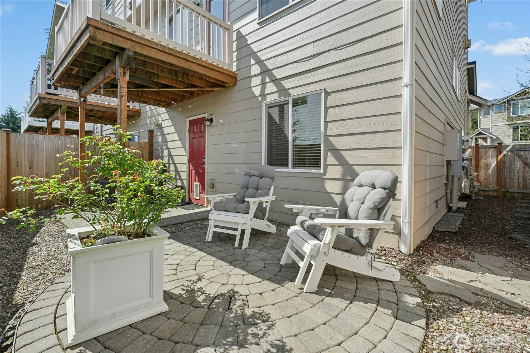 527 Pilchuck Path Everett, WA 98201 - Photo 32 of 38 a view of a patio with table and chairs and potted plants
