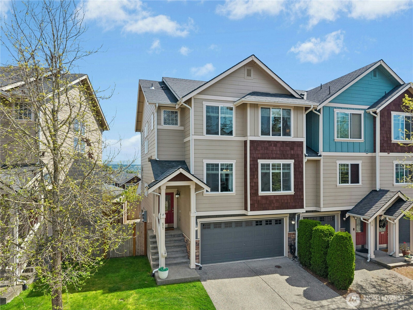 527 Pilchuck Path Everett, WA 98201 - Photo 4 of 38 a front view of a house with a yard