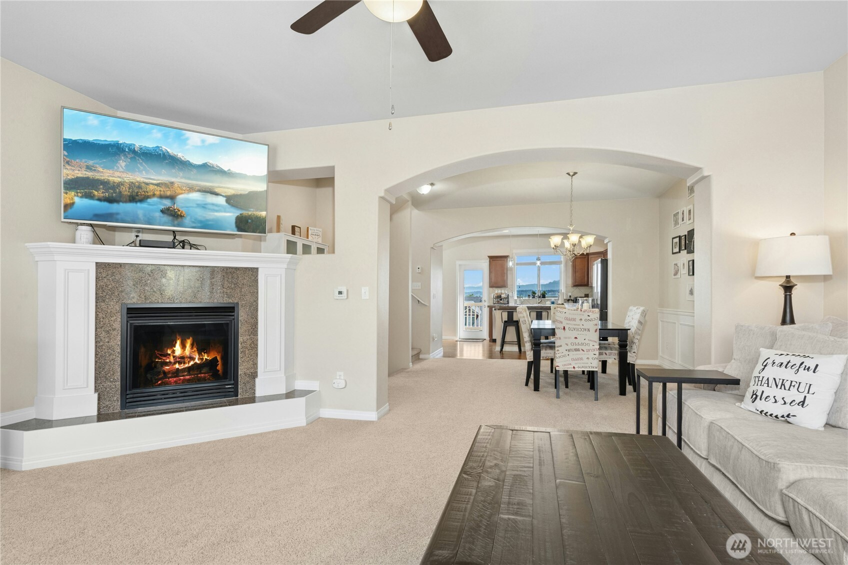 527 Pilchuck Path Everett, WA 98201 - Photo 8 of 38 a living room with furniture and a fireplace