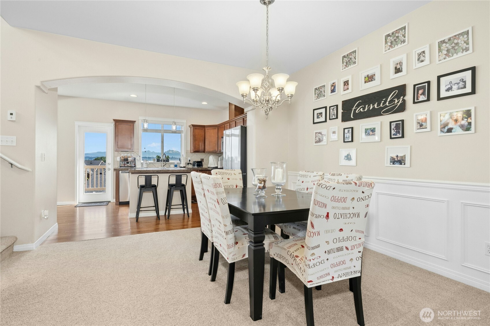 527 Pilchuck Path Everett, WA 98201 - Photo 9 of 38 a view of a dining room with furniture and a chandelier