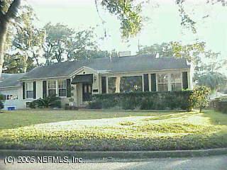 1142 Nicholson Road Jacksonville, FL 32207 - Photo 1 of 1 a front view of a house with a yard