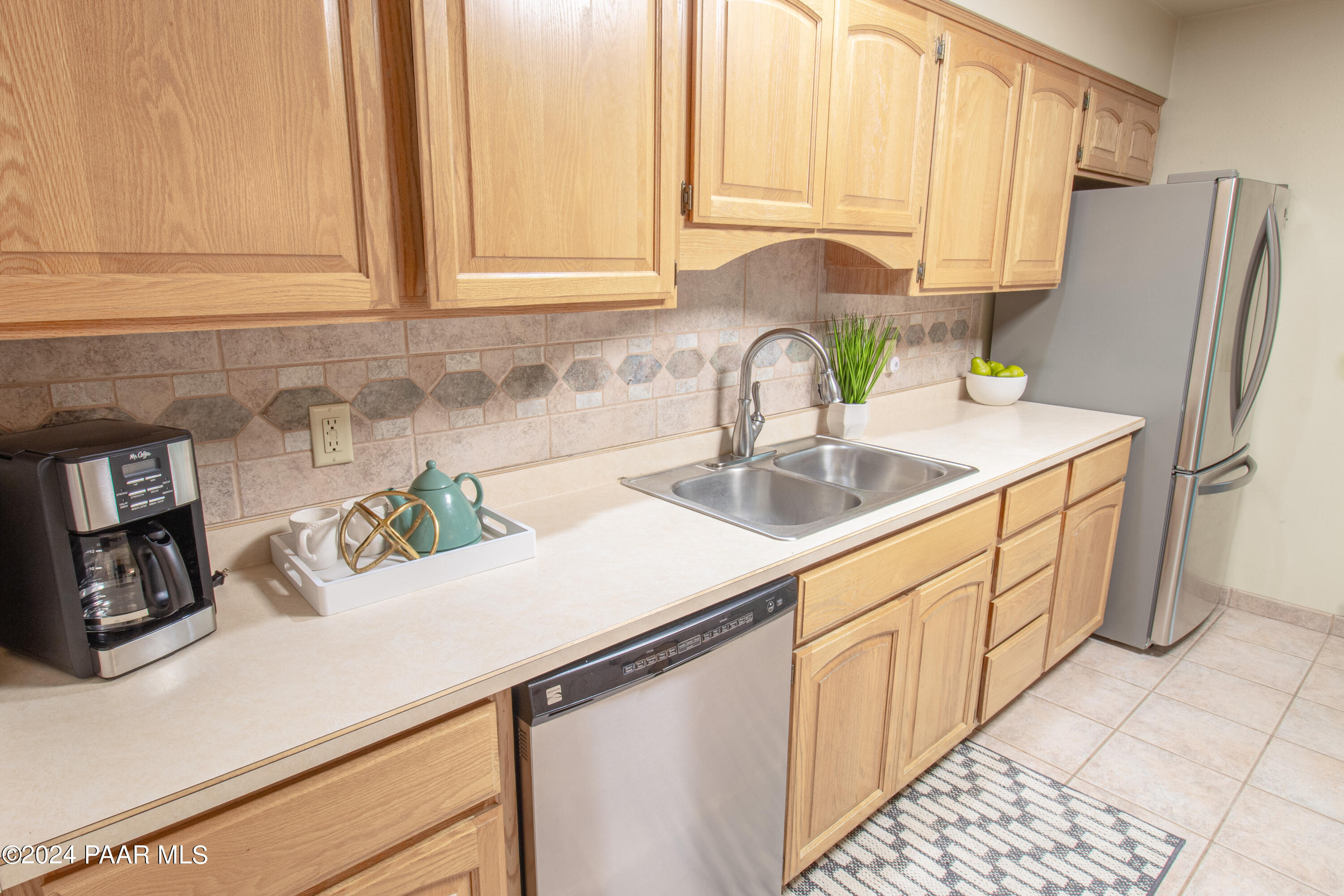 481 Turtleback Road Prescott, AZ 86303 - Photo 19 of 71 a kitchen with stainless steel appliances granite countertop a sink and a white cabinets