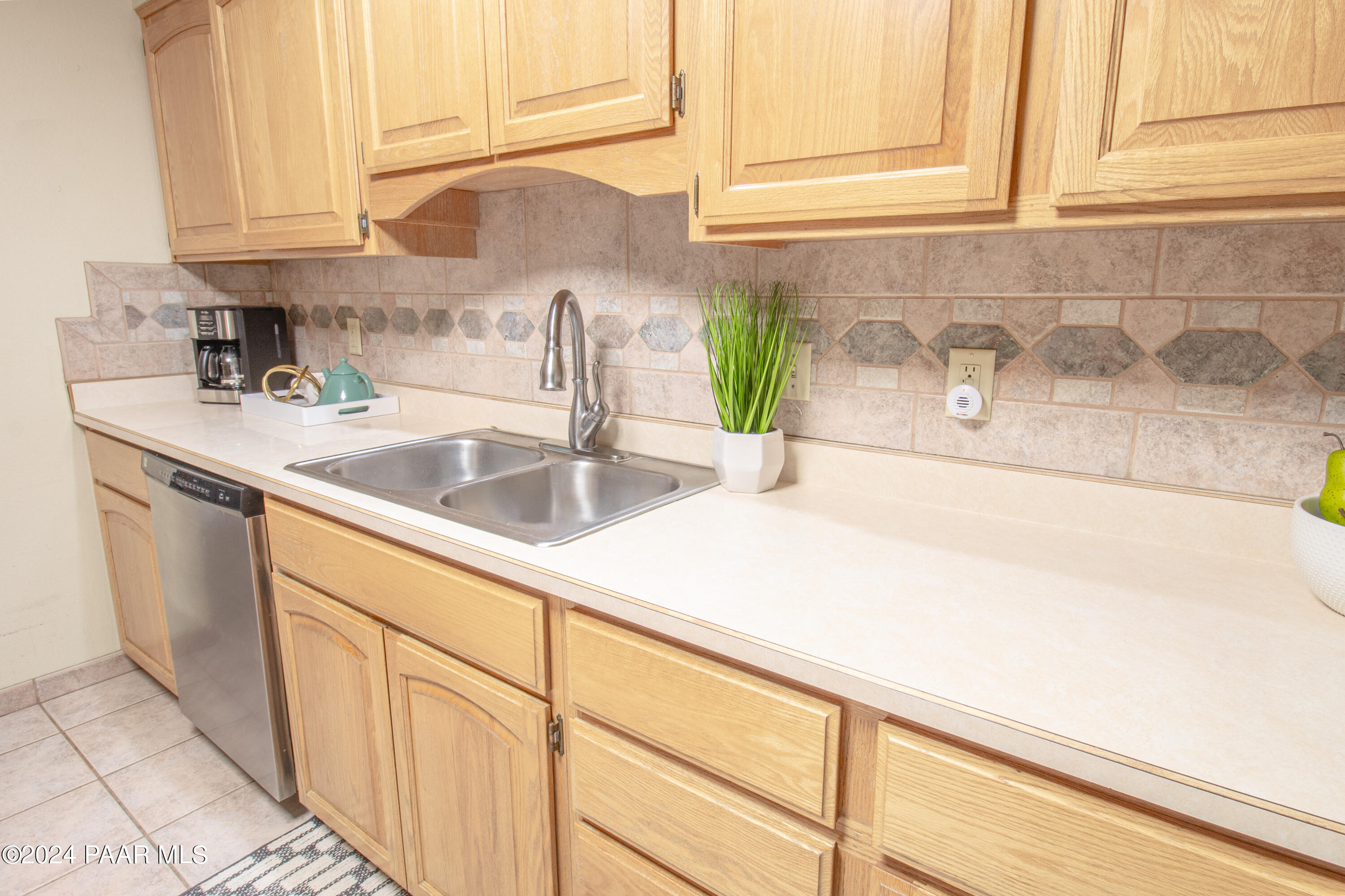 481 Turtleback Road Prescott, AZ 86303 - Photo 22 of 71 a kitchen with stainless steel appliances granite countertop a sink and a white cabinets