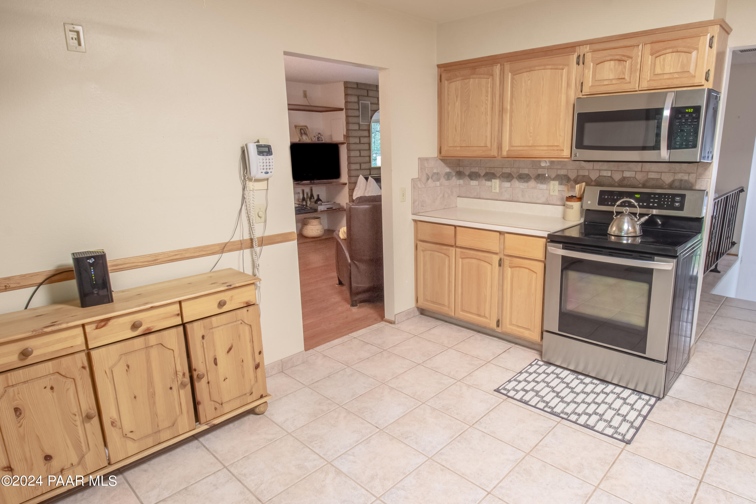 481 Turtleback Road Prescott, AZ 86303 - Photo 23 of 71 a kitchen with stainless steel appliances a stove microwave and cabinets