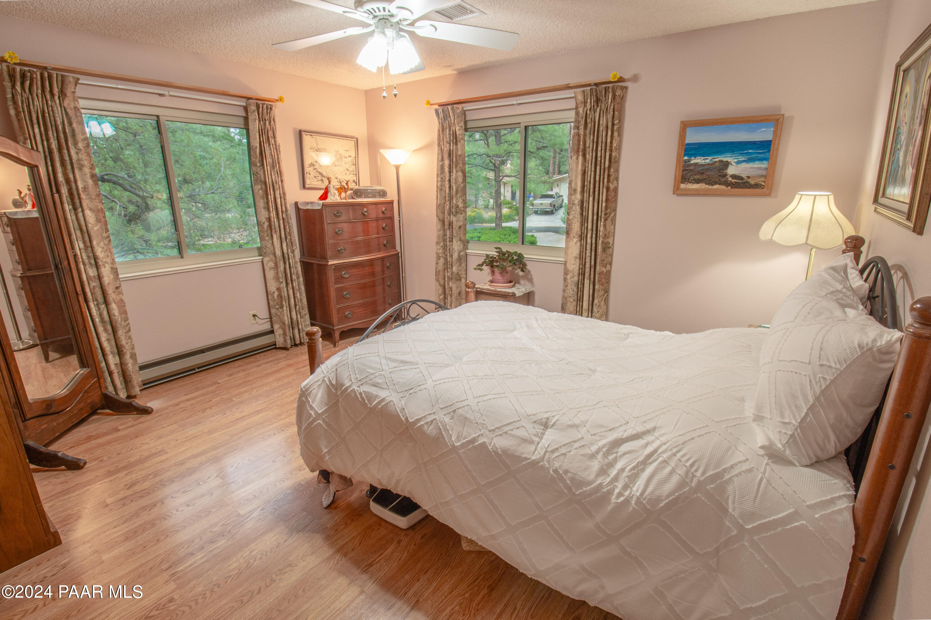 481 Turtleback Road Prescott, AZ 86303 - Photo 31 of 71 a bedroom with a bed and a large window