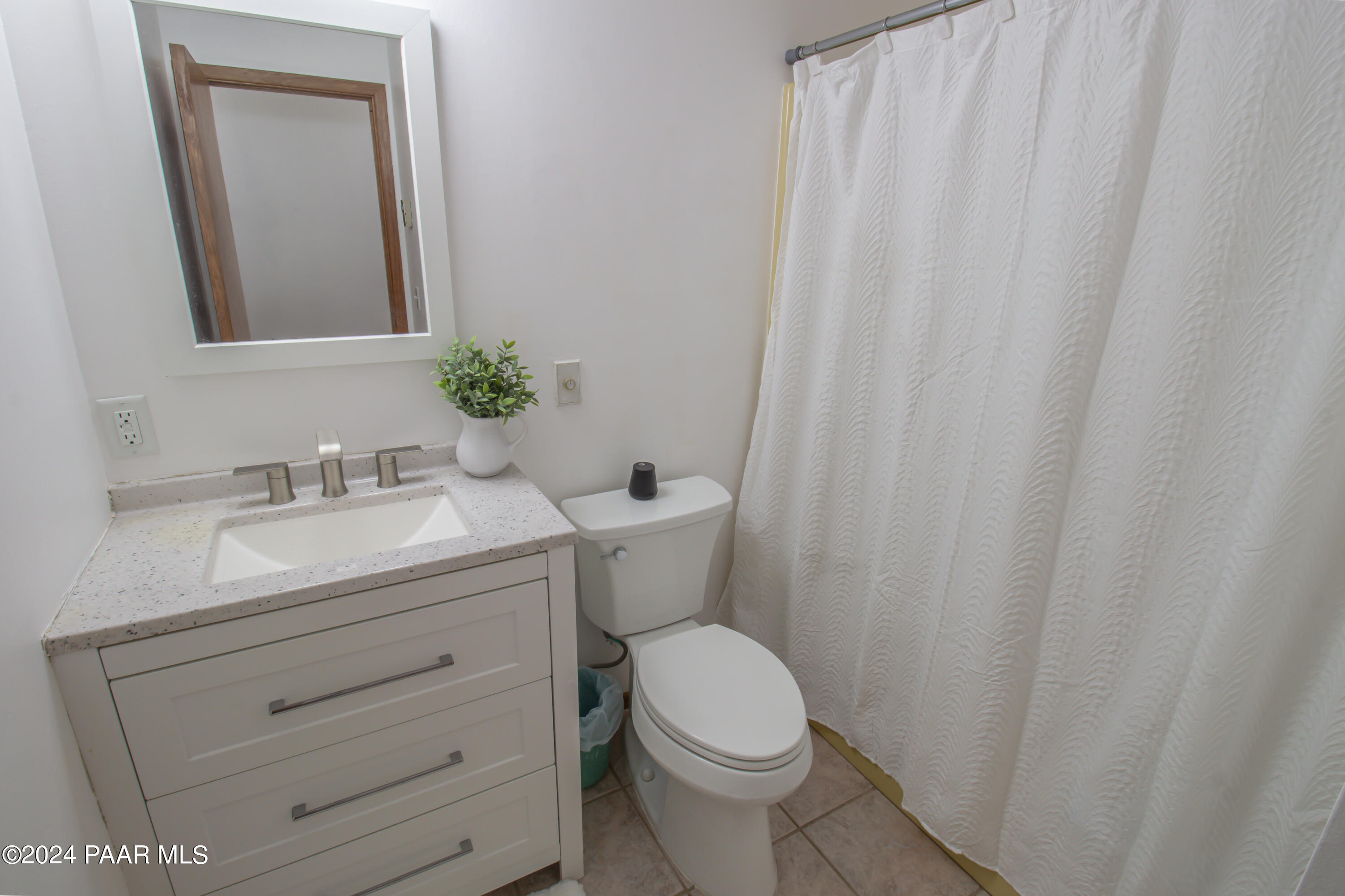 481 Turtleback Road Prescott, AZ 86303 - Photo 33 of 71 a bathroom with a granite countertop sink toilet and mirror