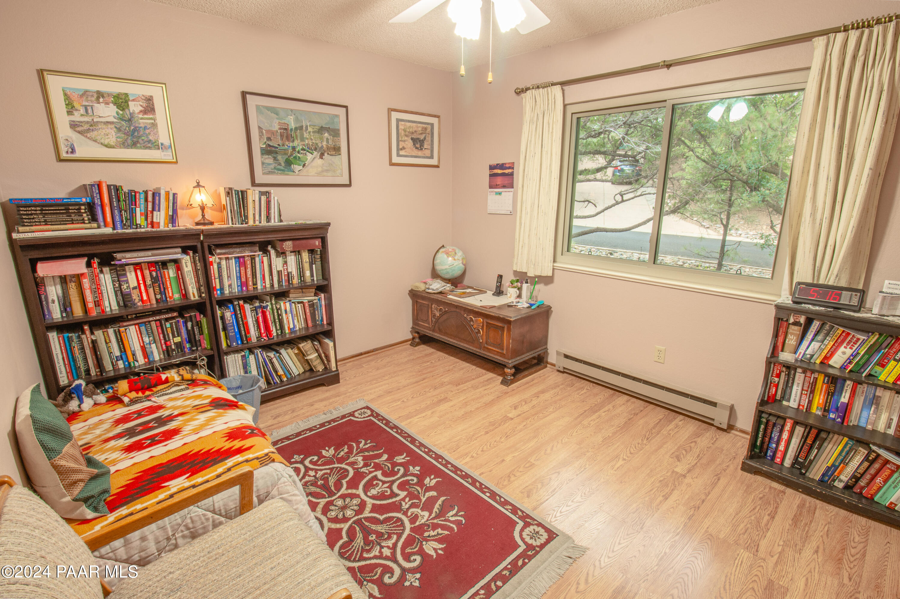481 Turtleback Road Prescott, AZ 86303 - Photo 34 of 71 a bedroom with furniture and book shelf