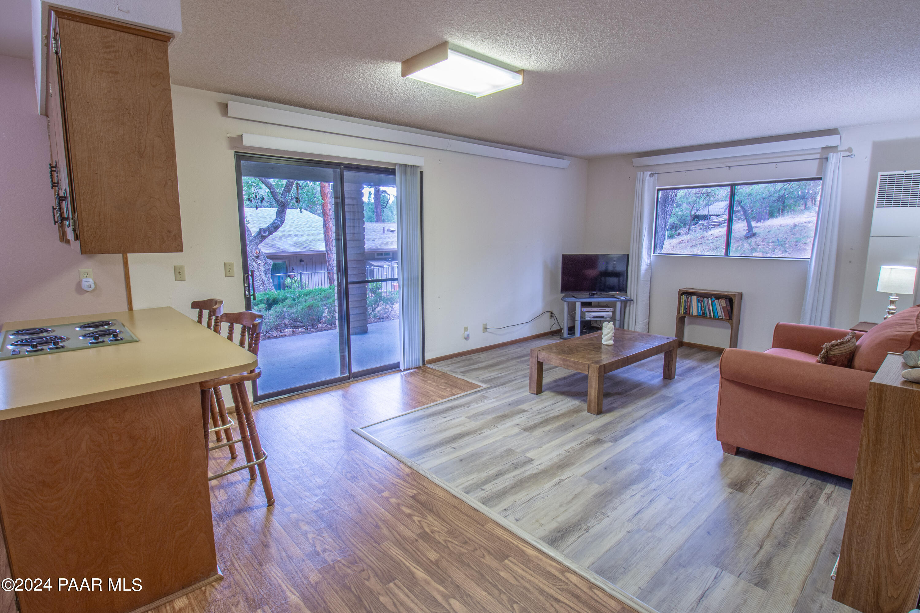 481 Turtleback Road Prescott, AZ 86303 - Photo 36 of 71 a living room with furniture a fireplace and a flat screen tv
