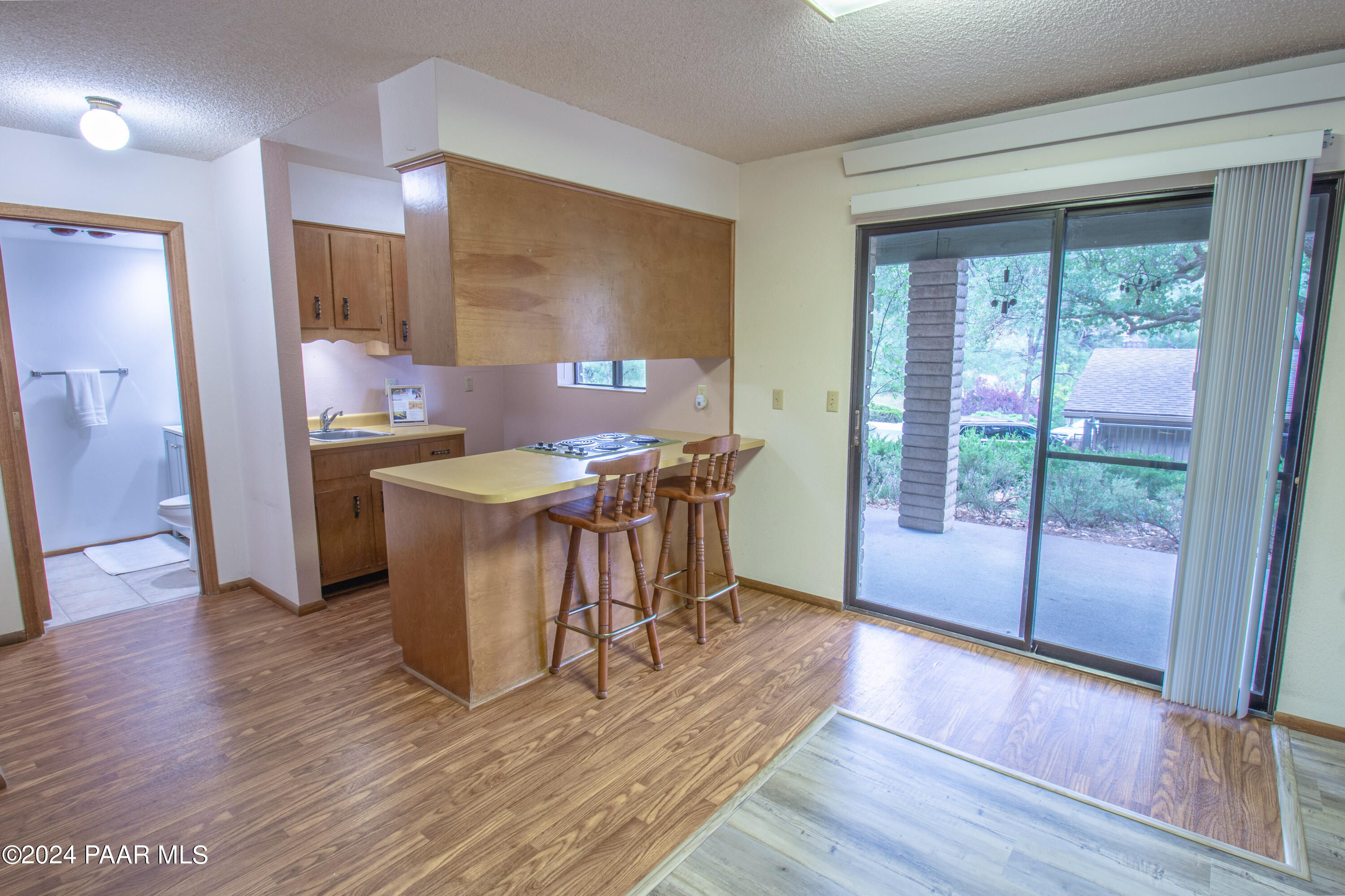 481 Turtleback Road Prescott, AZ 86303 - Photo 37 of 71 a view of a kitchen with kitchen island a sink a counter top space and stainless steel appliances