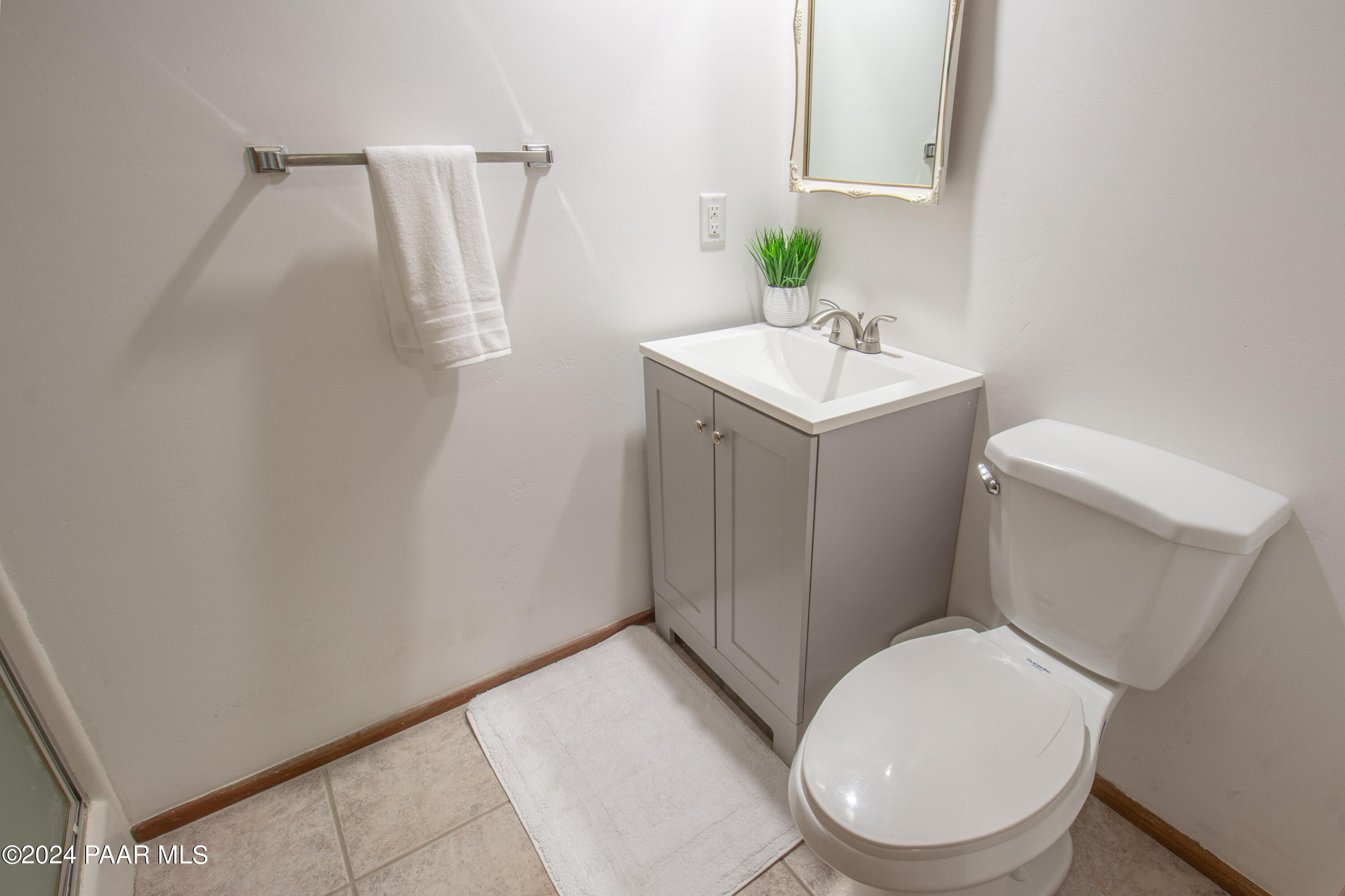 481 Turtleback Road Prescott, AZ 86303 - Photo 41 of 71 a white toilet sitting next to a bathroom sink