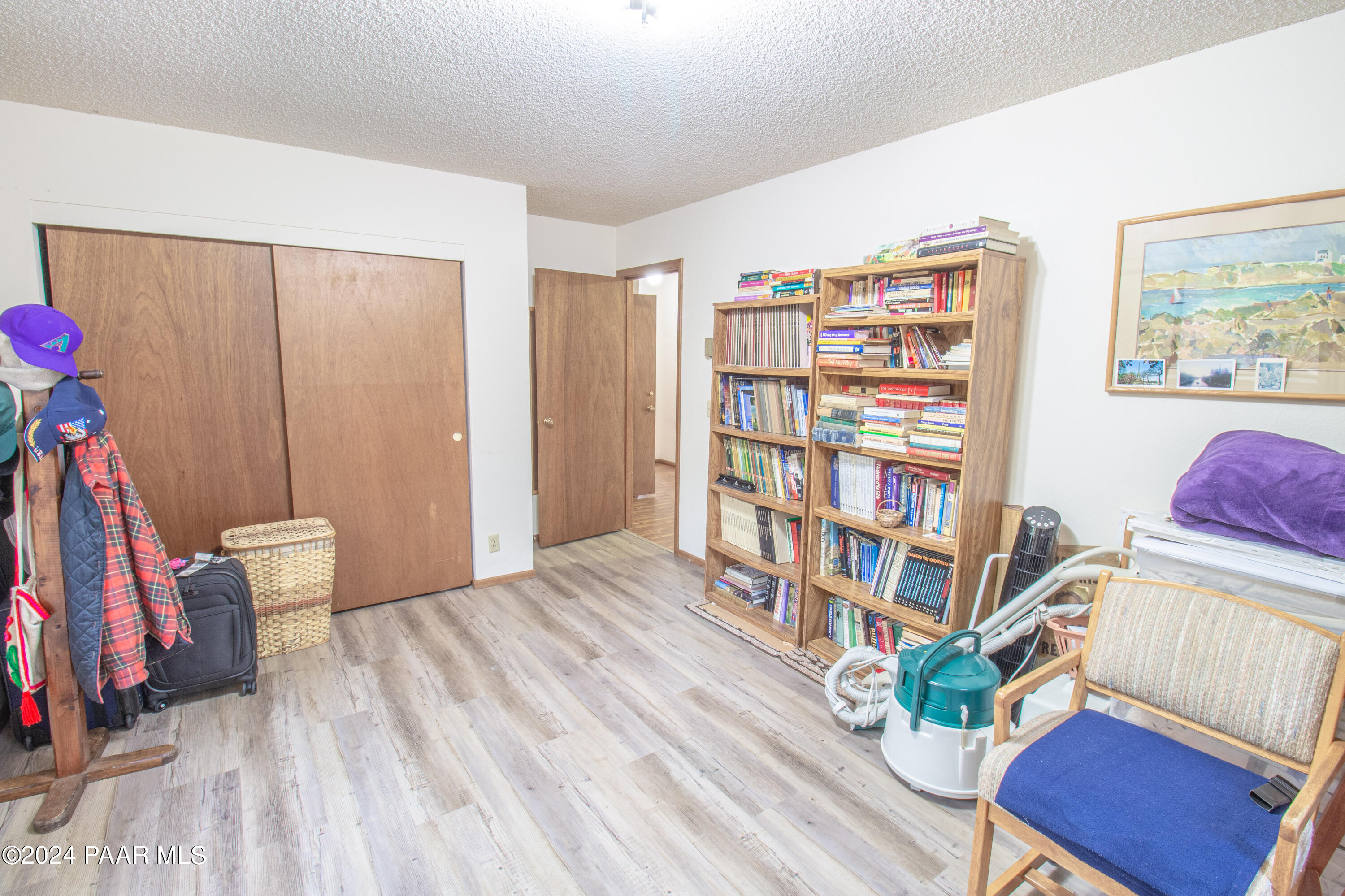 481 Turtleback Road Prescott, AZ 86303 - Photo 48 of 71 a view of a bedroom with furniture and book shelf