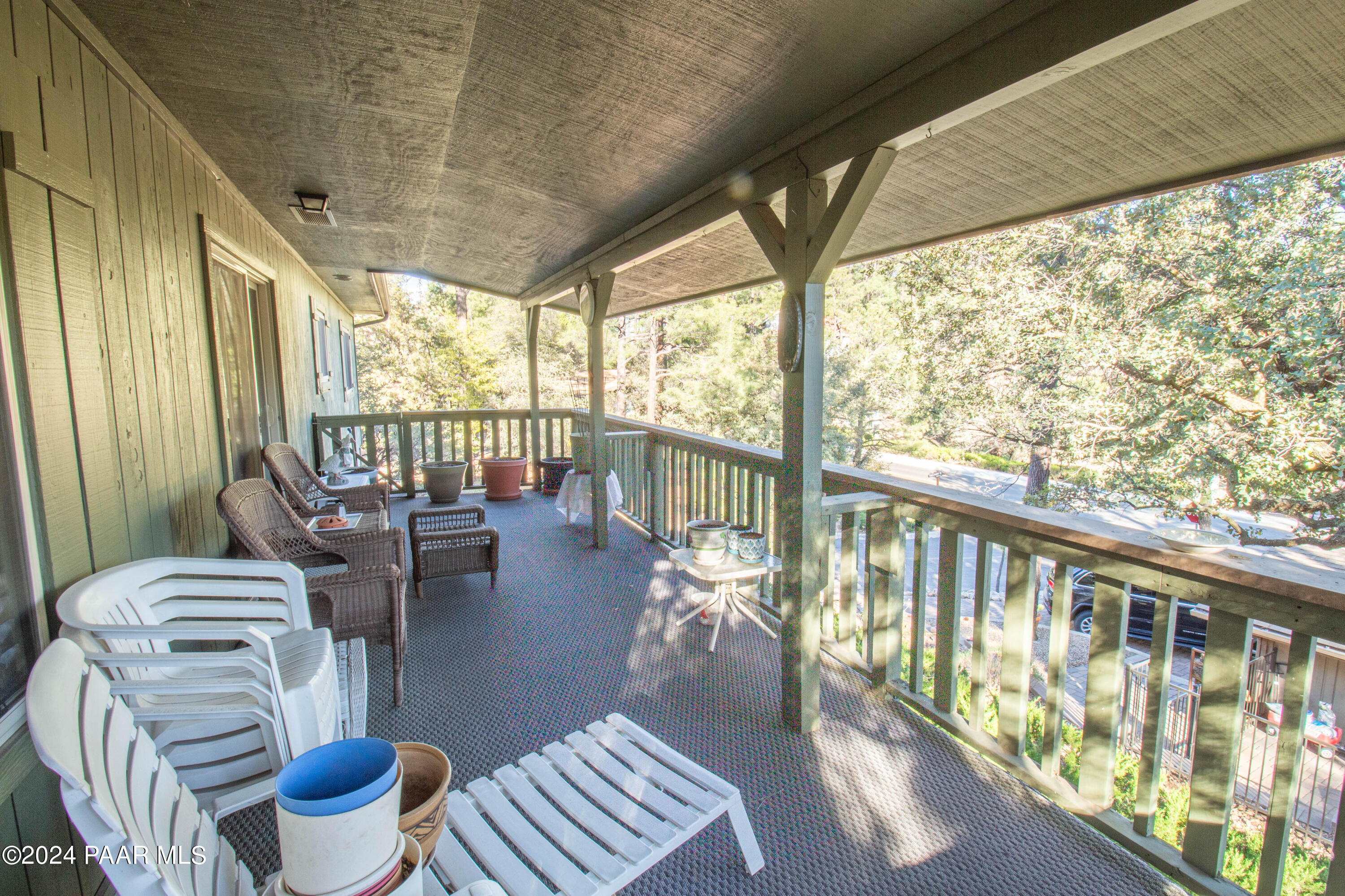 481 Turtleback Road Prescott, AZ 86303 - Photo 49 of 71 a living room with furniture and a floor to ceiling window