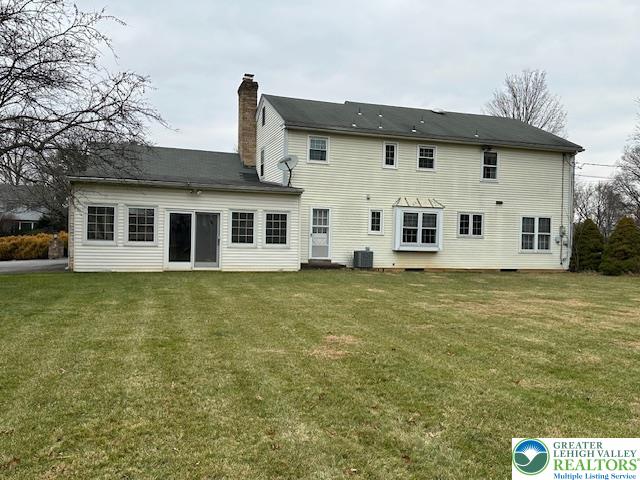 801 Yorkshire Road Bethlehem, PA 18017 - Photo 2 of 2 a view of a white house with large windows next to a yard