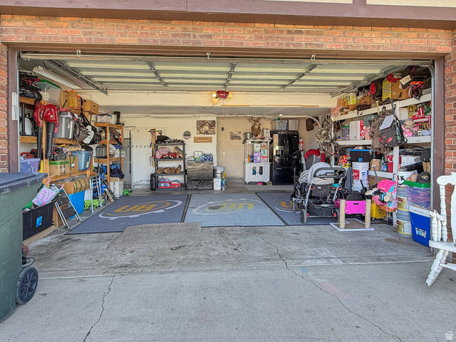 1716 Sagewood Road Price, UT 84501 - Photo 65 of 73 Garage featuring black refrigerator with ice dispenser