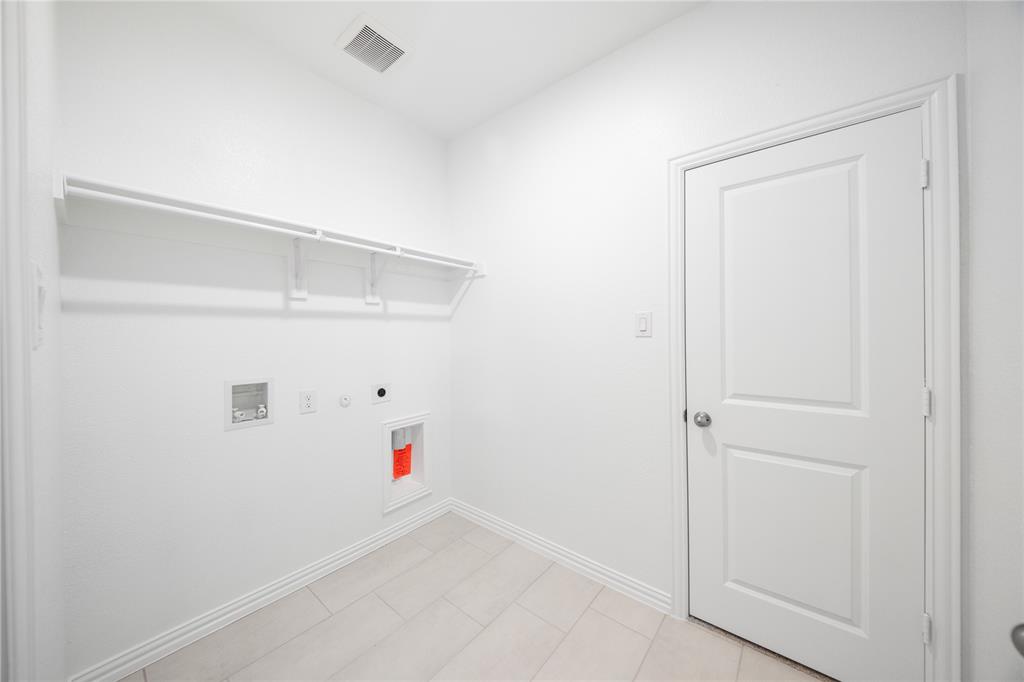 2606 Hawkins Street Anna, TX 75409 - Photo 14 of 31 a view of an empty walk in closet