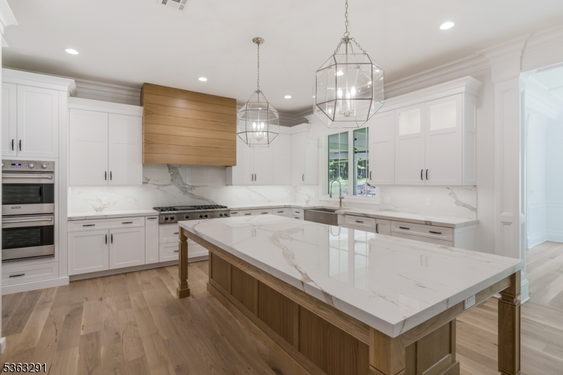 8 Cobblestone Court Warren, NJ 07059 - Photo 26 of 50 a kitchen with a stove a sink and a refrigerator