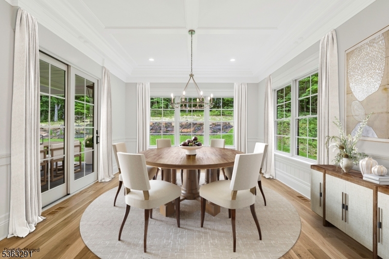 8 Cobblestone Court Warren, NJ 07059 - Photo 30 of 50 a dining room with furniture large windows and a chandelier