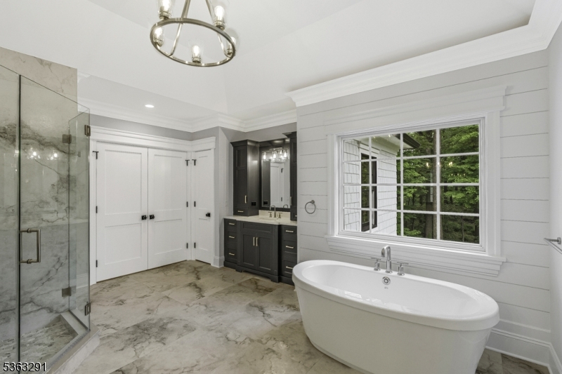 8 Cobblestone Court Warren, NJ 07059 - Photo 41 of 50 a spacious bathroom with a tub sink shower and mirror