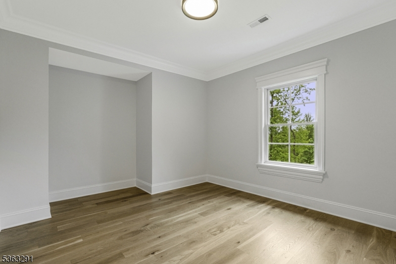 8 Cobblestone Court Warren, NJ 07059 - Photo 42 of 50 an empty room with wooden floor and windows