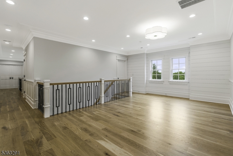 8 Cobblestone Court Warren, NJ 07059 - Photo 47 of 50 an empty room with wooden floor and windows