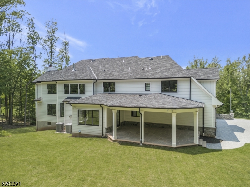 8 Cobblestone Court Warren, NJ 07059 - Photo 6 of 50 a front view of a house with a garden and yard
