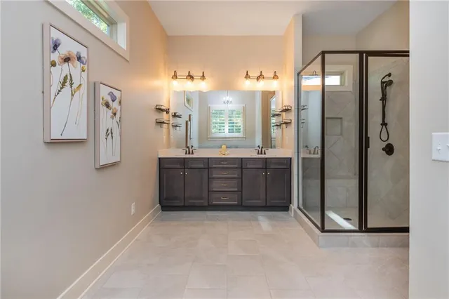 a spacious bathroom with a bathtub and a shower