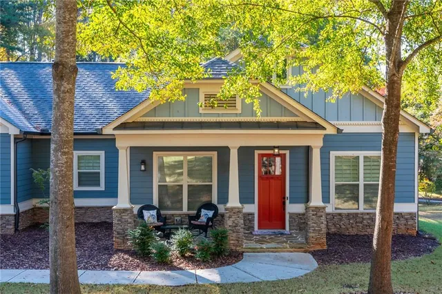 a front view of a house with garden