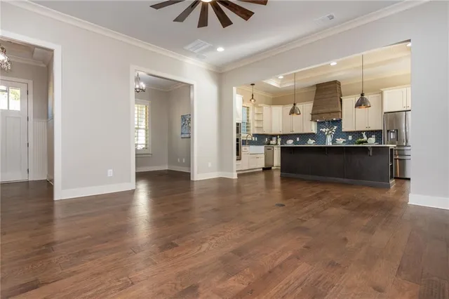 a view of a room with rack on the wall and a window