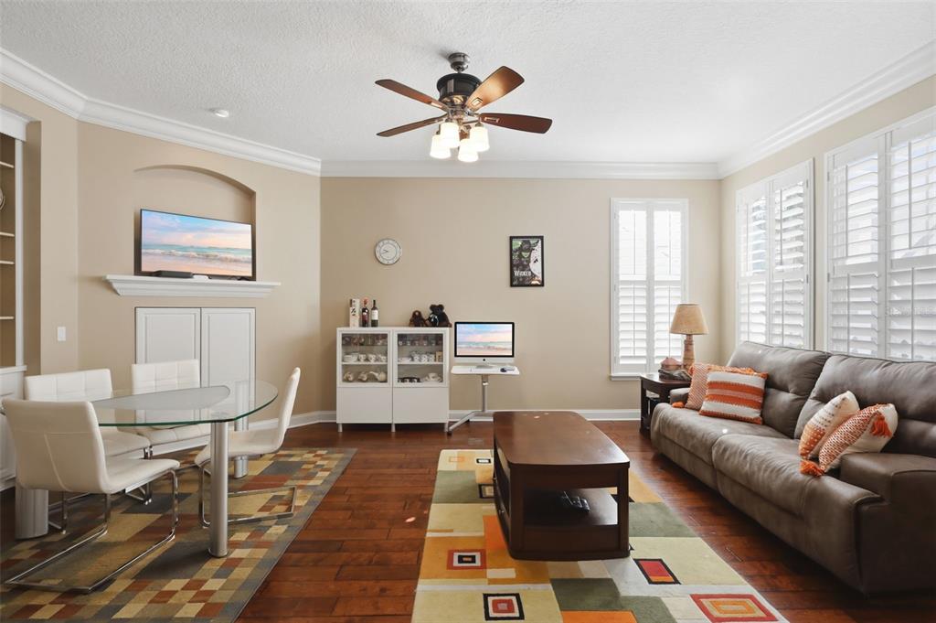 907 Pawstand Road Celebration, FL 34747 - Photo 12 of 49 a living room with furniture a table and a window