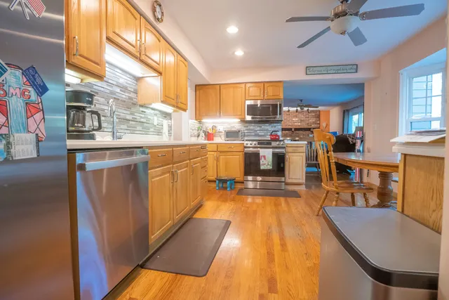 a kitchen with lots of counter top space and a window