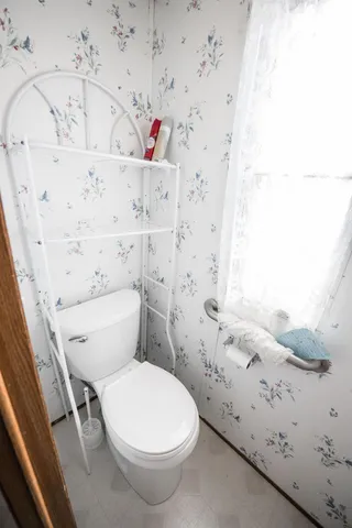 a bathroom with a toilet and sink