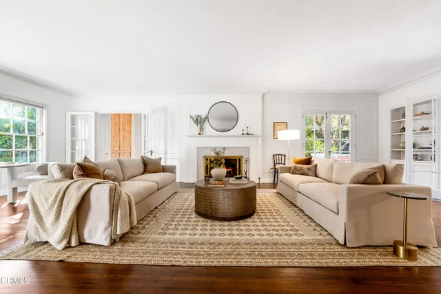 a living room with furniture and a fireplace