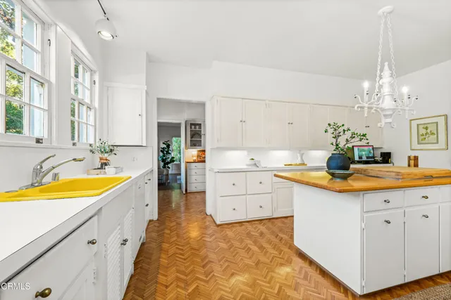 a spacious bathroom with a granite countertop sink a mirror a bathtub and shower