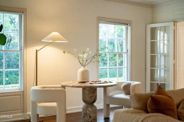 a living room with furniture and a window