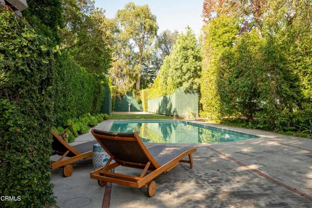 a view of a backyard with a bench