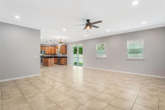 a view of a kitchen with furniture and wooden floor