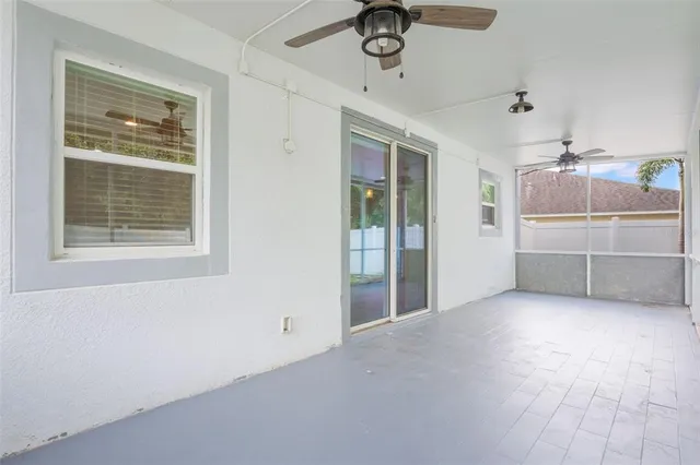a view of an empty room with a window