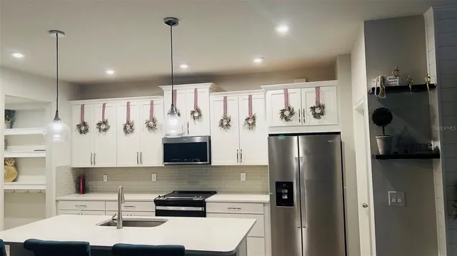 a spacious bathroom with a shower sink and mirror