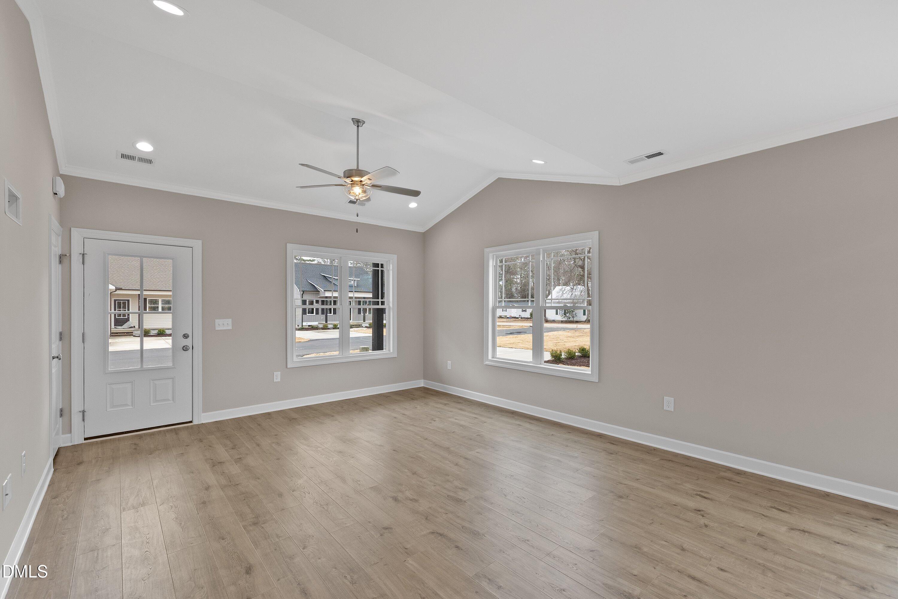 926 Micro Road West Selma, NC 27576 - Photo 13 of 41 a view of an empty room with a window and wooden floor
